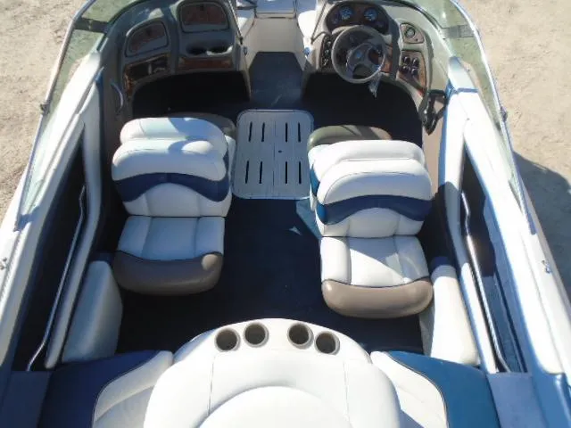 Slide: The Image of 1998 Tahoe Q5L I/O boat interior with white and blue seating. - 12