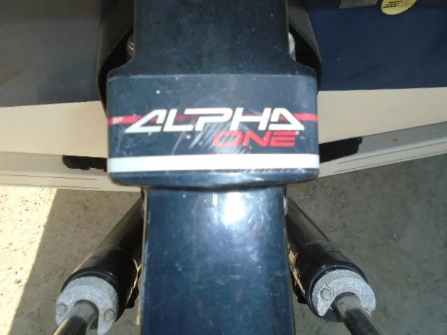 Slide: The Image of Close-up of Alpha One outdrive on 1998 Tahoe Q5L I/O boat. - 16