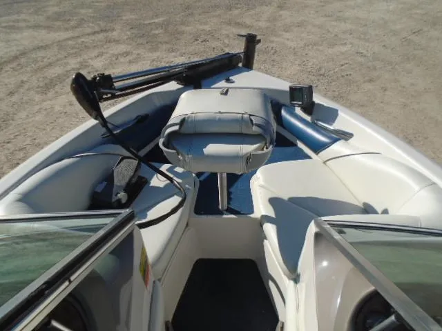 Slide: The Image of 1998 Tahoe Q5L I/O boat interior with seating and fishing equipment. - 3