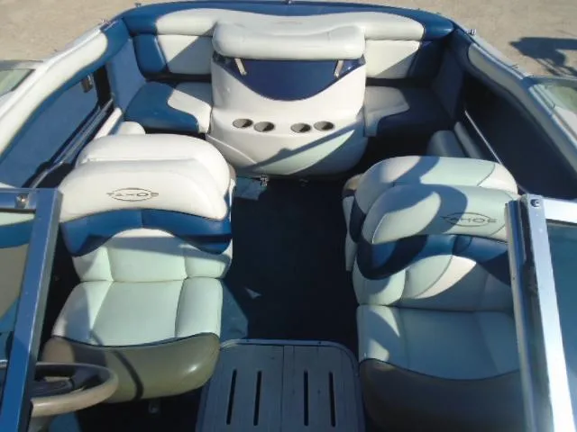 Slide: The Image of 1998 Tahoe Q5L I/O boat interior with white and blue seating. - 6