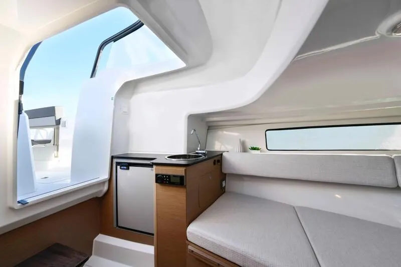 Slide: The Image of Interior of 2024 Jeanneau Leader 7.5 WA S3 with kitchenette and seating area. - 8