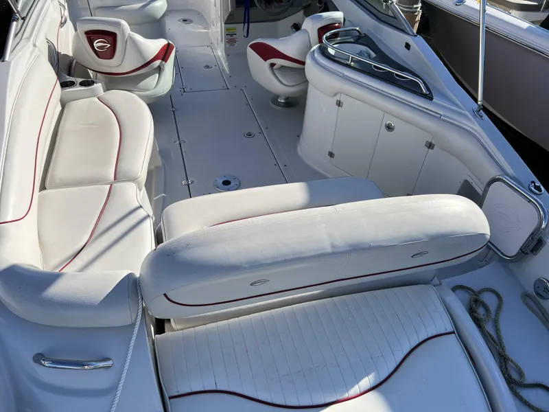 Slide: The Image of 2008 Crownline 240 EX boat interior with white and red seating. - 12