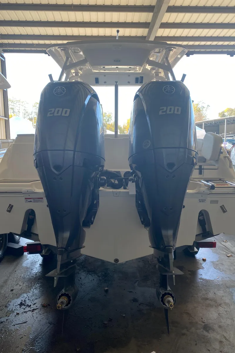 Slide: The Image of 2024 Sea Fox 268 Traveler with twin 200 horsepower outboard engines. - 12