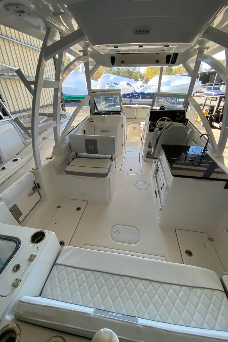 Slide: The Image of 2024 Sea Fox 268 Traveler boat interior with seating and helm station. - 3