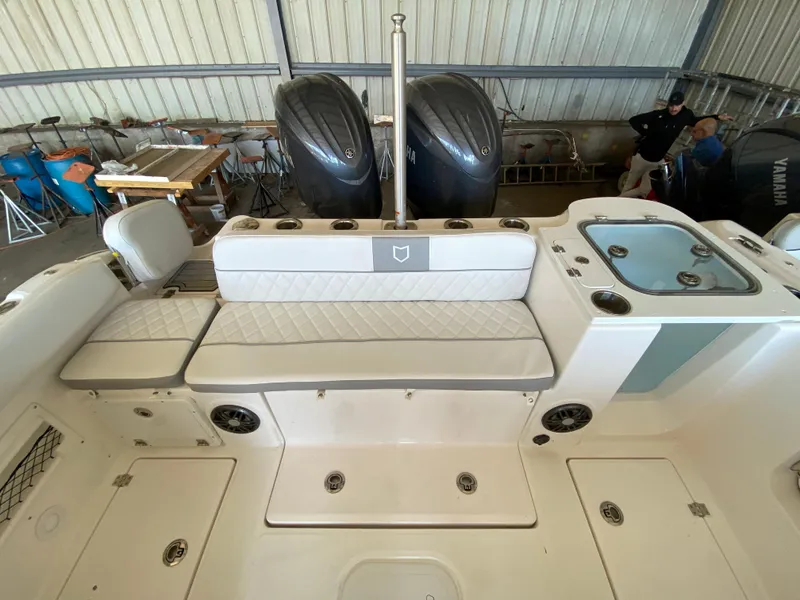 Slide: The Image of 2024 Sea Fox 268 Traveler boat interior with seating and dual outboard motors. - 8