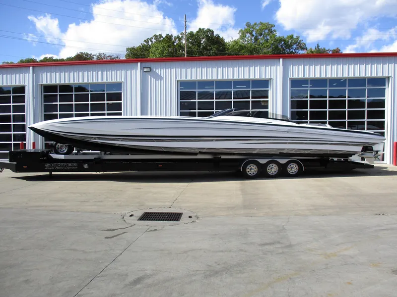The Image of 2015 Skater 46 boat on a trailer in front of a garage. - 1