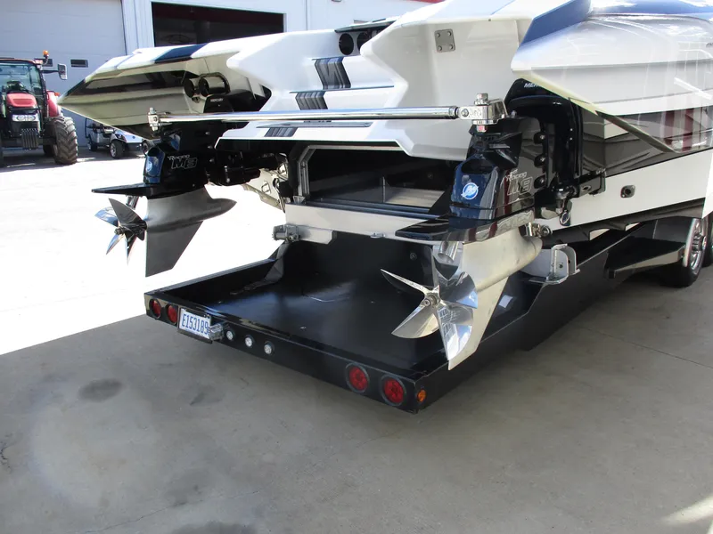 Slide: The Image of Rear view of a 2015 Skater 46 boat with dual propellers. - 10