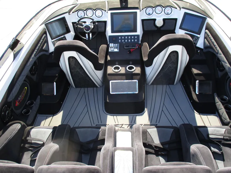 Slide: The Image of Interior of a 2015 Skater 46 speedboat with modern dashboard and seating. - 15