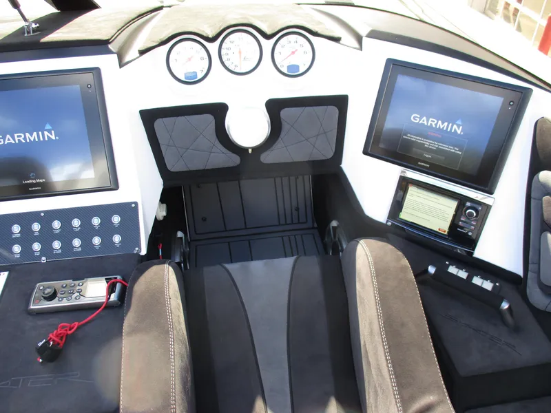 Slide: The Image of Skater 46 boat cockpit with Garmin navigation screens and control panel, model year 2015. - 19
