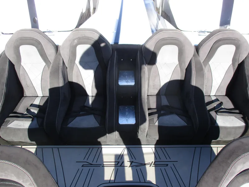 Slide: The Image of 2015 Skater 46 boat interior with four black racing seats - 22