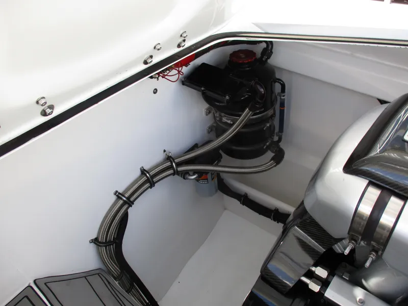 Slide: The Image of Engine compartment of a 2015 Skater 46 boat with visible wiring and components. - 25