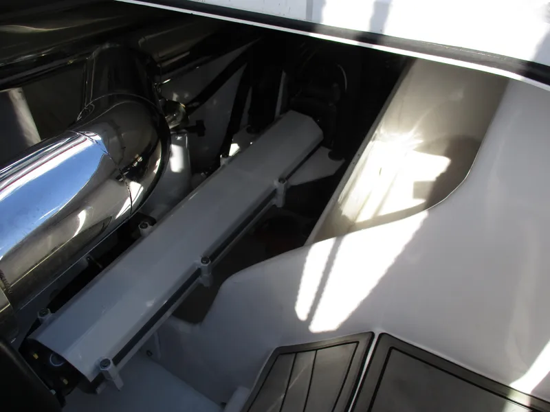 Slide: The Image of Engine compartment of a 2015 Skater 46 boat with metallic components. - 26