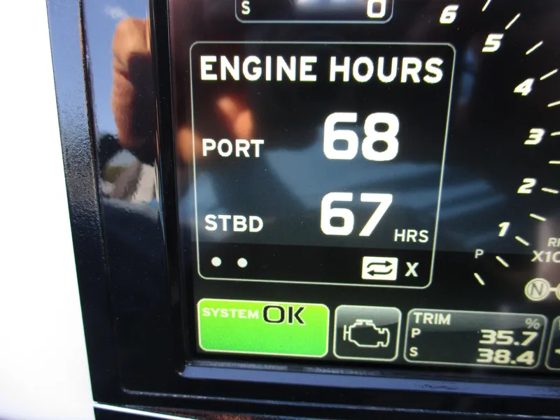Slide: The Image of Close-up of Skater 46 engine hours display, showing 68 port and 67 starboard hours. - 29