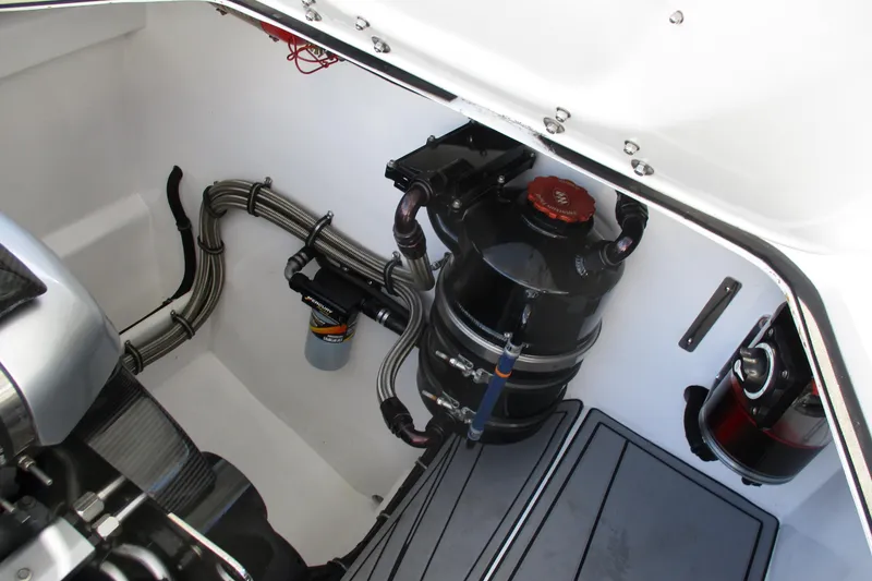 Slide: The Image of Engine compartment of a 2015 Skater 46 boat with visible components and wiring. - 30