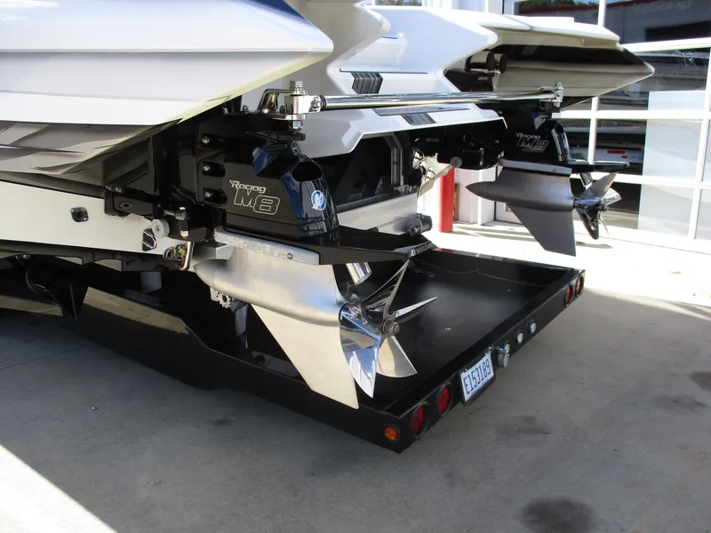 Slide: The Image of Rear view of a 2015 Skater 46 boat with twin propellers on a trailer. - 8
