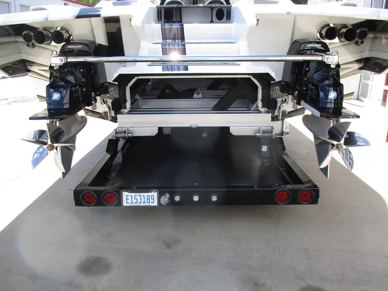 Slide: The Image of Rear view of a 2015 Skater 46 boat with dual propellers and trailer. - 9