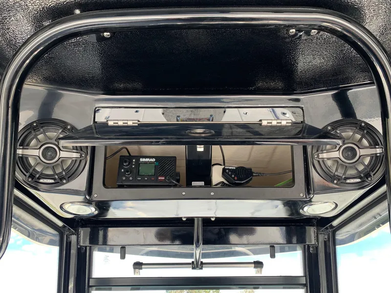 Slide: The Image of 2024 Robalo 266 Cayman boat console with speakers and Simrad electronics. - 10