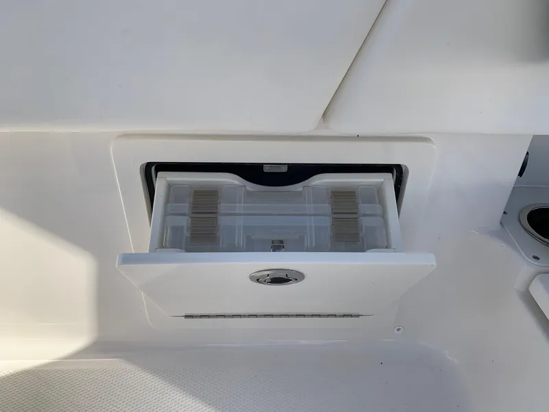 Slide: The Image of Storage compartment on 2024 Robalo 266 Cayman boat. - 14
