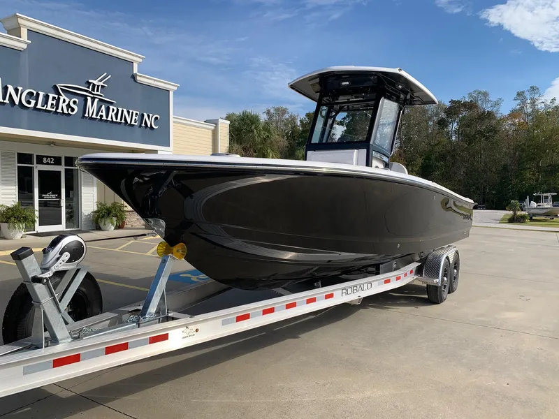 Slide: The Image of 2024 Robalo 266 Cayman boat on trailer at Anglers Marine NC dealership. - 2