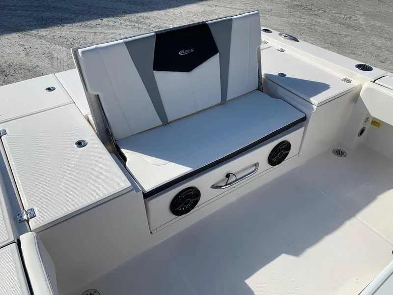 Slide: The Image of 2024 Robalo 266 Cayman boat seating area with built-in speakers. - 8