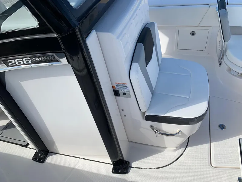 Slide: The Image of 2024 Robalo 266 Cayman boat interior seating and console. - 17