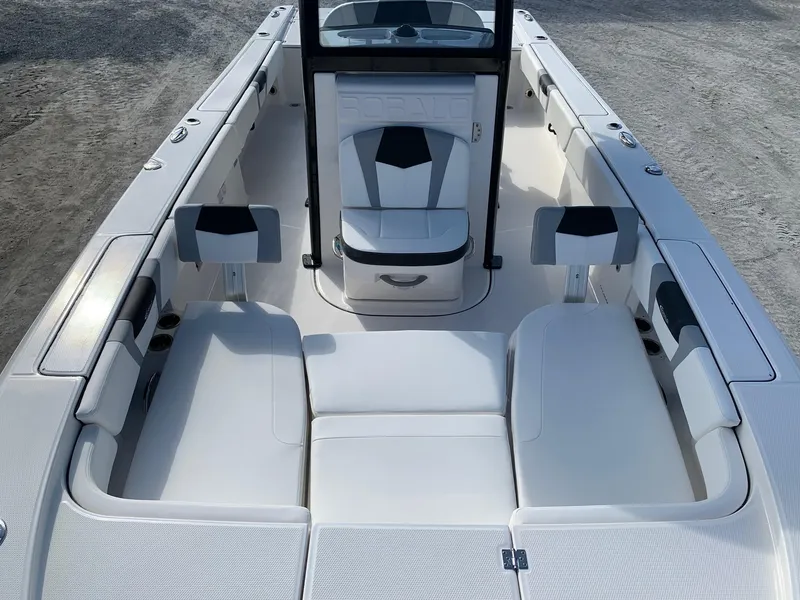 Slide: The Image of 2024 Robalo 266 Cayman boat interior with white seating and console. - 20
