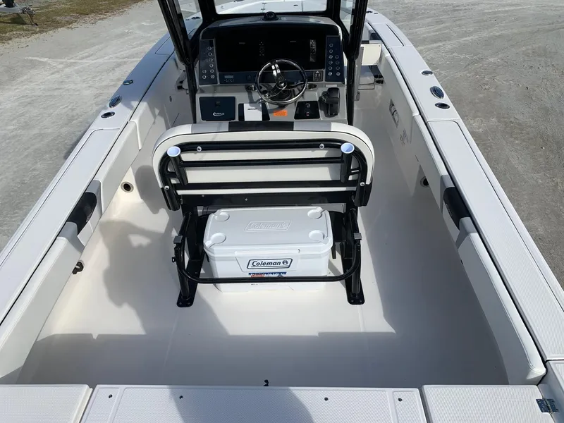 Slide: The Image of 2024 Robalo 266 Cayman boat interior with helm and seating. - 21