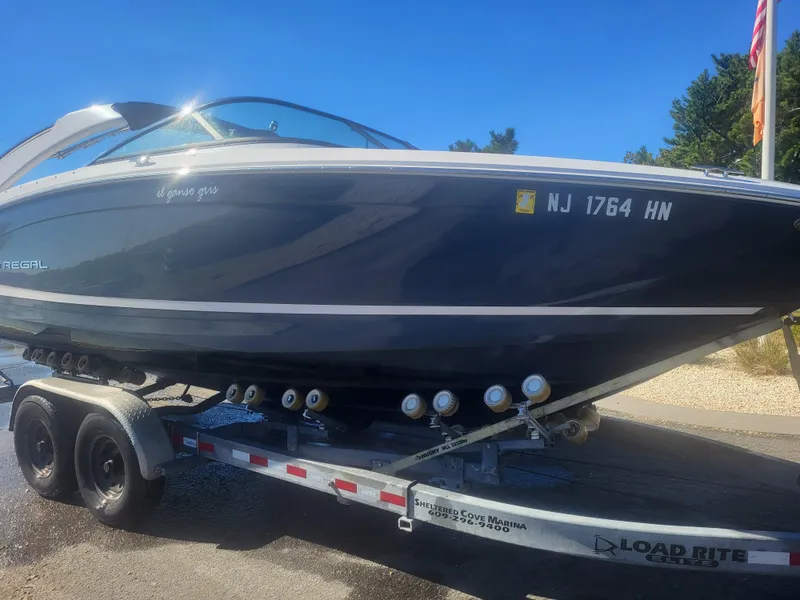 Slide: The Image of 2019 Regal LS6 boat on trailer, side view, sunny day, New Jersey registration. - 4