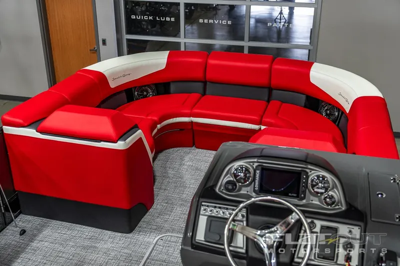 Slide: The Image of 2023 South Bay 523 RS 3.0 Plus Arch 400HP boat interior with red and white seating. - 16