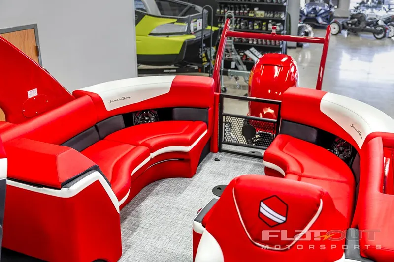 Slide: The Image of 2023 South Bay 523 RS 3.0 Plus Arch 400HP interior with red and white seating. - 2