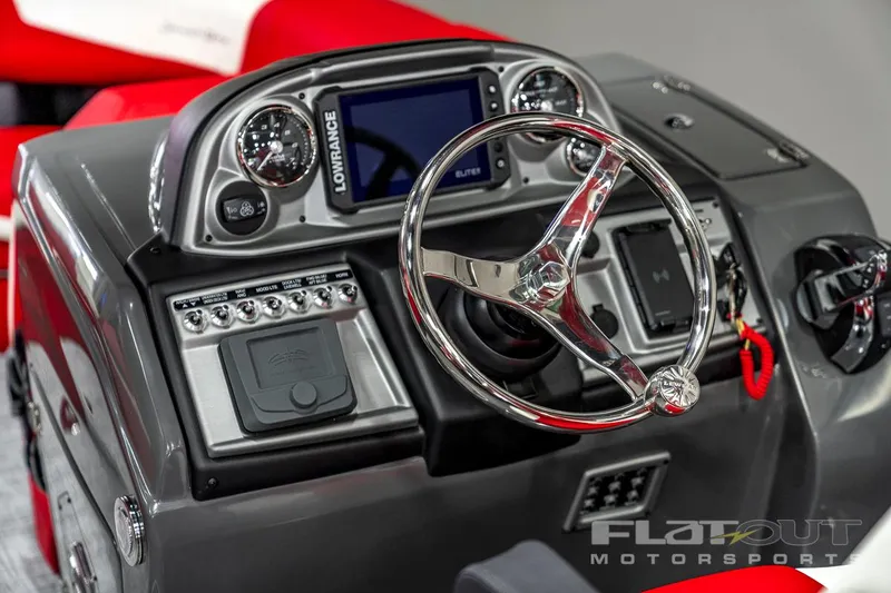 Slide: The Image of 2023 South Bay 523 RS 3.0 Plus Arch 400HP boat dashboard with steering wheel and controls. - 22