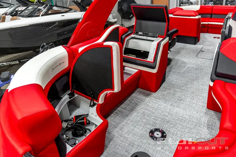 Slide: The Image of 2023 South Bay 523 RS 3.0 Plus Arch 400HP interior with red and white seating. - 5