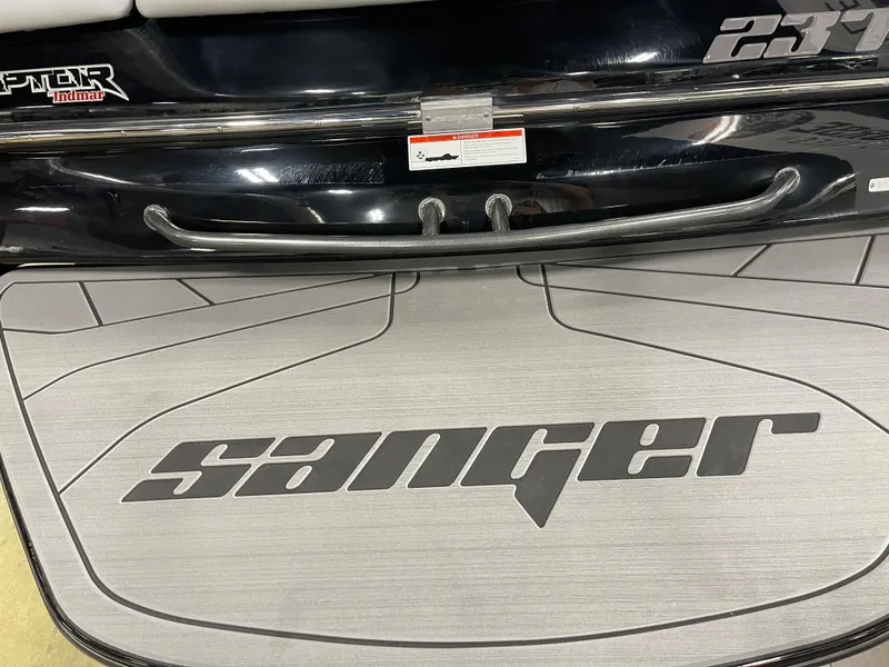Slide: The Image of 2023 Sanger 237 SX boat rear deck with logo and Raptor engine. - 10