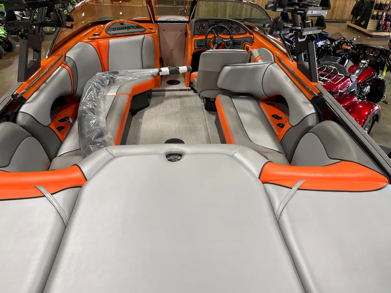 Slide: The Image of 2023 Sanger 237 SX boat interior with orange and gray seating. - 12