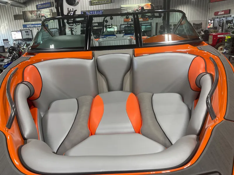 Slide: The Image of 2023 Sanger 237 SX boat interior with orange and gray seating. - 6