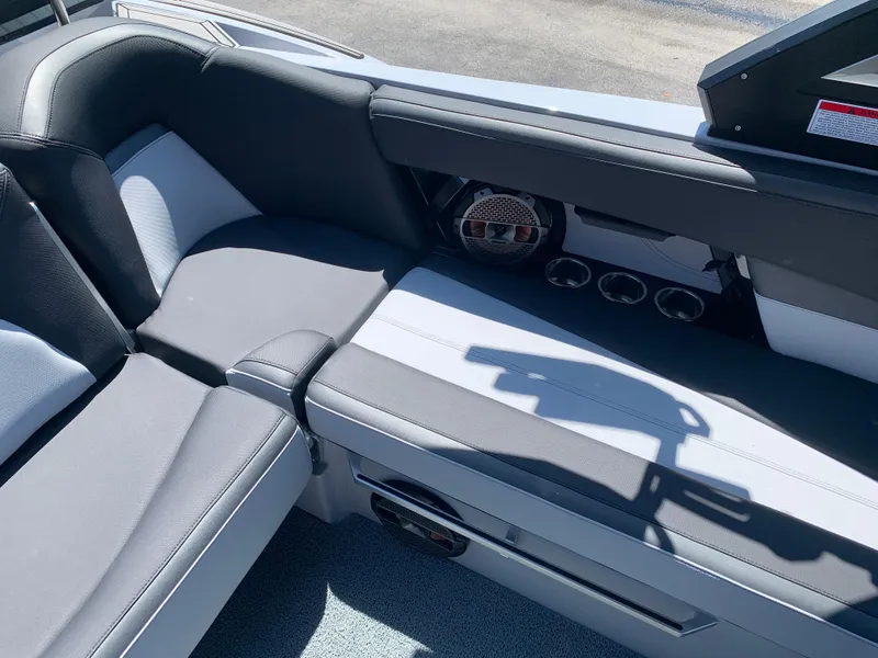 Slide: The Image of Interior seating of 2022 MasterCraft XStar S boat with black and white upholstery. - 15