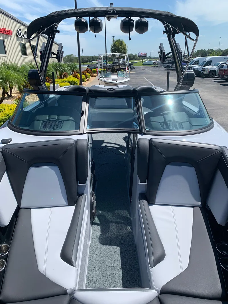 Slide: The Image of 2022 MasterCraft XStar S boat interior with black and white seating. - 2
