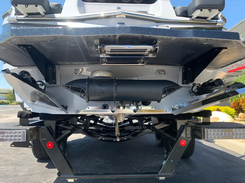 Slide: The Image of 2022 MasterCraft XStar S boat on trailer, rear view showing hull and components. - 8