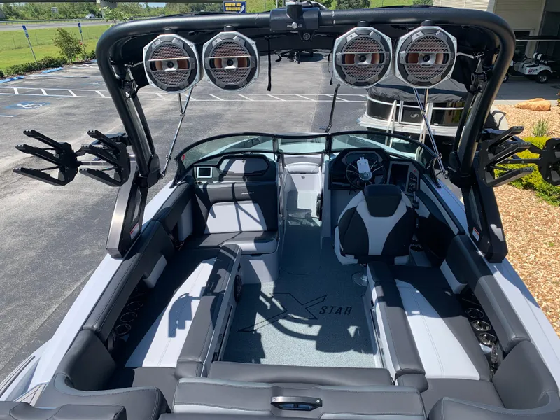 Slide: The Image of 2022 MasterCraft XStar S interior with premium seating and advanced audio system. - 9