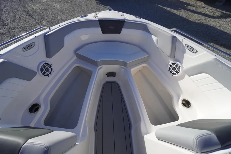 Slide: The Image of 2024 Chaparral 23 SSi OB boat interior with seating and storage compartments. - 10
