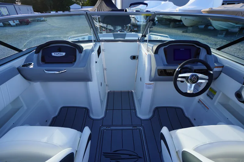 Slide: The Image of 2024 Chaparral 23 SSi OB boat interior with modern dashboard and steering wheel. - 14