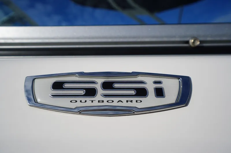 Slide: The Image of 2024 Chaparral 23 SSi OB emblem on boat exterior, showcasing sleek design. - 3