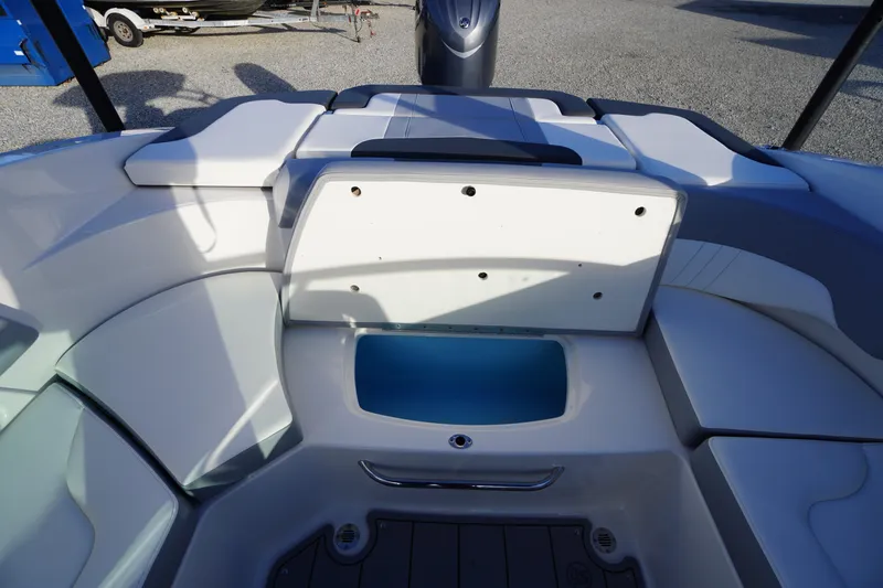 Slide: The Image of 2024 Chaparral 23 SSi OB boat interior with seating and storage compartment. - 36