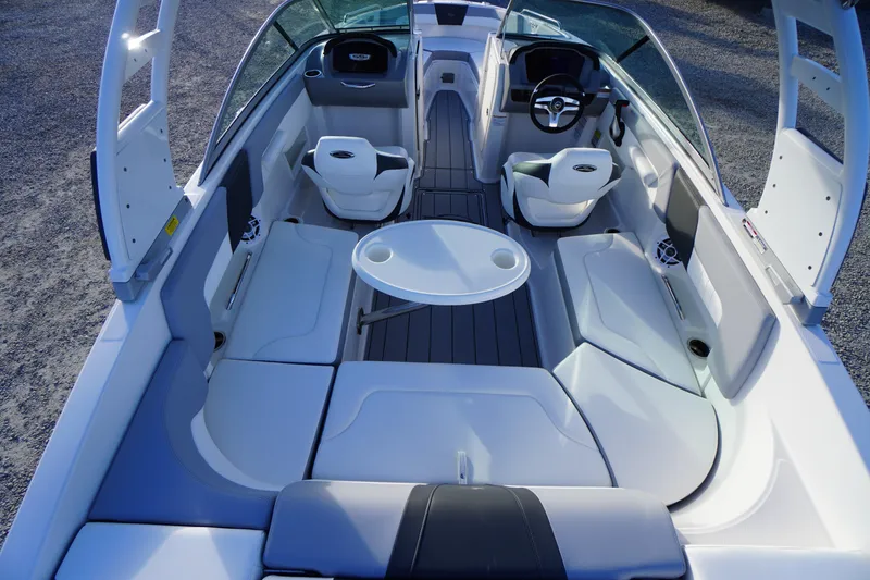 Slide: The Image of 2024 Chaparral 23 SSi OB boat interior with seating and steering wheel. - 38