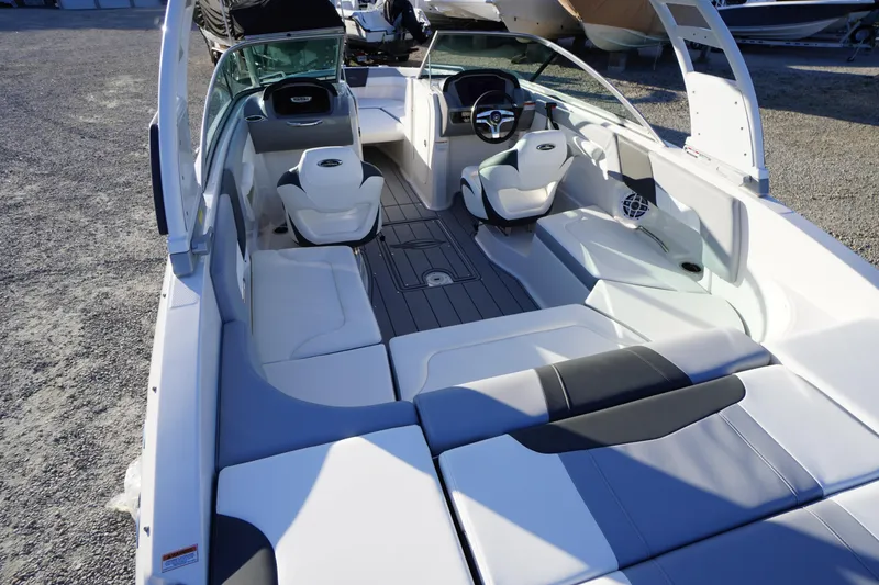 Slide: The Image of 2024 Chaparral 23 SSi OB boat interior with modern seating and steering wheel. - 39