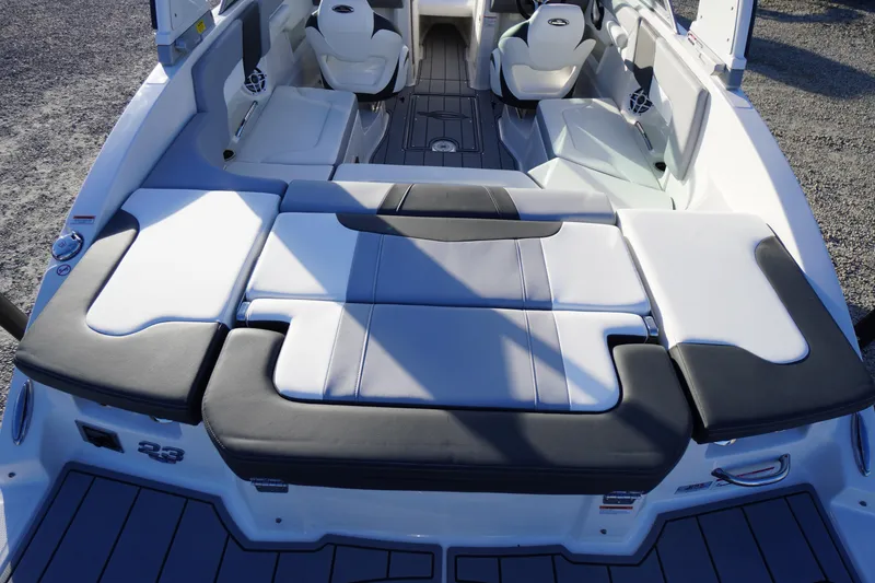 Slide: The Image of 2024 Chaparral 23 SSi OB boat interior with cushioned seating and modern design. - 40