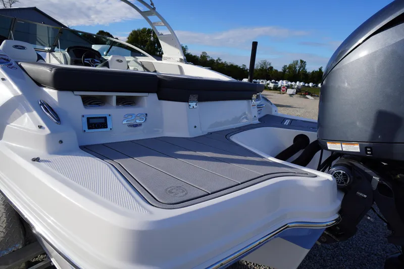 Slide: The Image of 2024 Chaparral 23 SSi OB boat with sleek design and powerful outboard motor. - 44