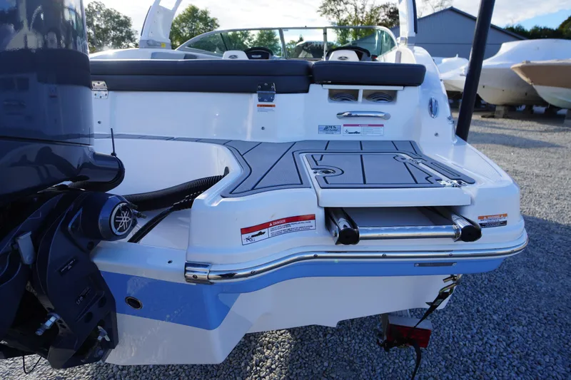 Slide: The Image of 2024 Chaparral 23 SSi OB boat stern with swim platform and outboard motor. - 45