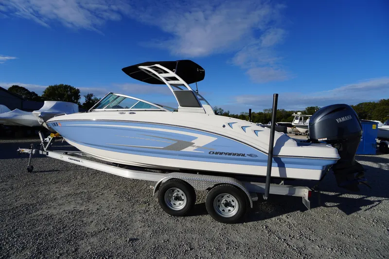 Slide: The Image of 2024 Chaparral 23 SSi OB boat on trailer, featuring sleek design and Yamaha outboard motor. - 53