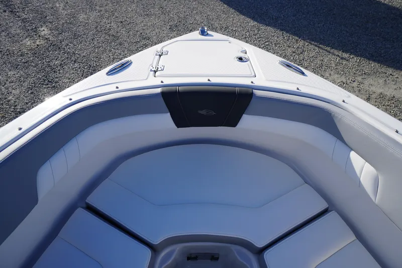 Slide: The Image of 2024 Chaparral 23 SSi OB boat interior with sleek seating and storage compartment. - 6